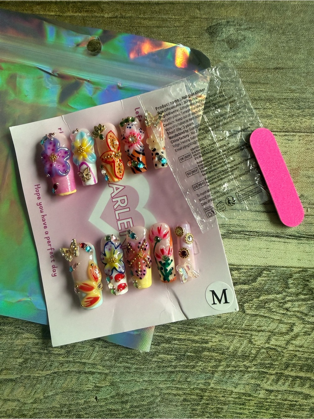 Press-On Nail Set size M new, never used. Pretty flowers and butterflies.
